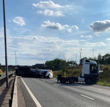 An overturned lorry on the M11