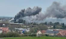 A plume of smoke over a town