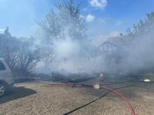 Firefighters at the scene of a shed fire