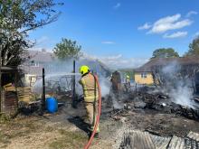 Firefighters at the scene of a shed fire