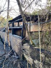 Fire damaged farm outbuilding