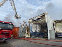 Aerial ladder platform working next to building