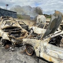 remains of a fire involving a number of cars