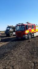 Colin's Green Goddess fire engine alongside one of our fire engines at a field fire