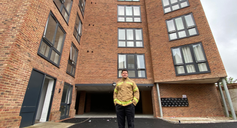 Jim Palmer standing in front of Amleen House Colchester