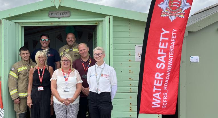 ECFRS staff with CVST staff in front of beach hut in Clacton