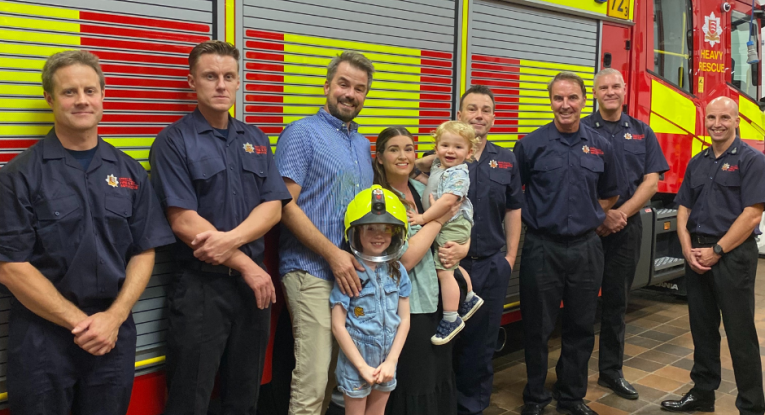 Firefiighters from Loughton Blue Watch with Draper family