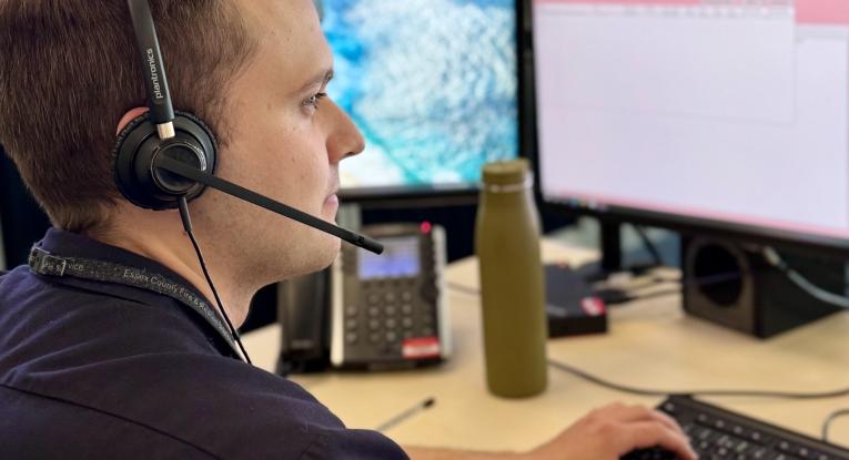 Jacob, control operator, sitting at desk in Control